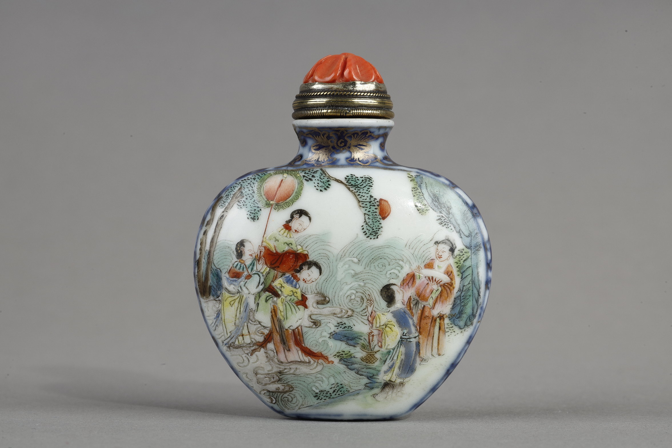 Porcelain snuff bottle , decorated in polychrome and blue underglaze  of characters in a garden on one side and an erotic scene on the other side - China mark and period Qianlong 1736/1795